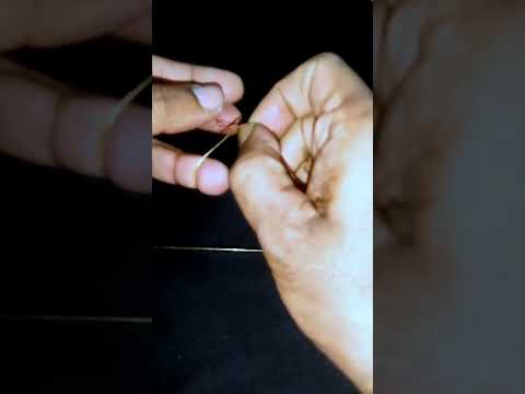 Tying knot at fishing line.  মাছ ধরার সুতা গিট deya