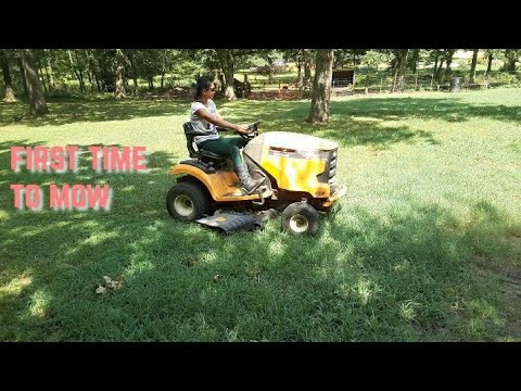Mowing grass for the first time.