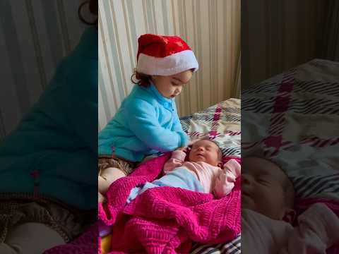 Cute Girl Meeting Newborn Brother