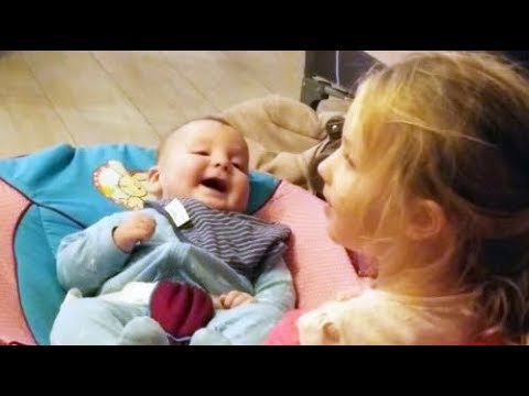 Cute Baby is happy whil;e playing with his 3 years old Sister