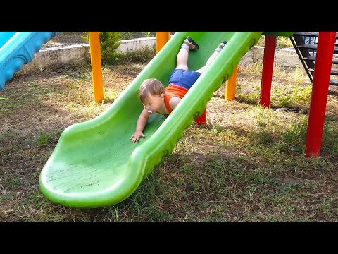 One years old baby upside down on the slider - Funny Babies 2020
