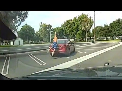 Video shows man on drugs kick, punch through family's car in front of police
