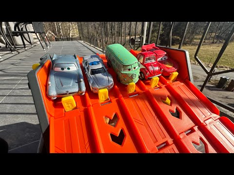 Cars going down a track into water