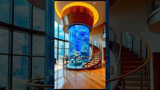✨ These spiral staircase aquariums look absolutely mesmerizing! 👏🐠🏡 #AquariumGoals #HomeDecor 🔍✨
